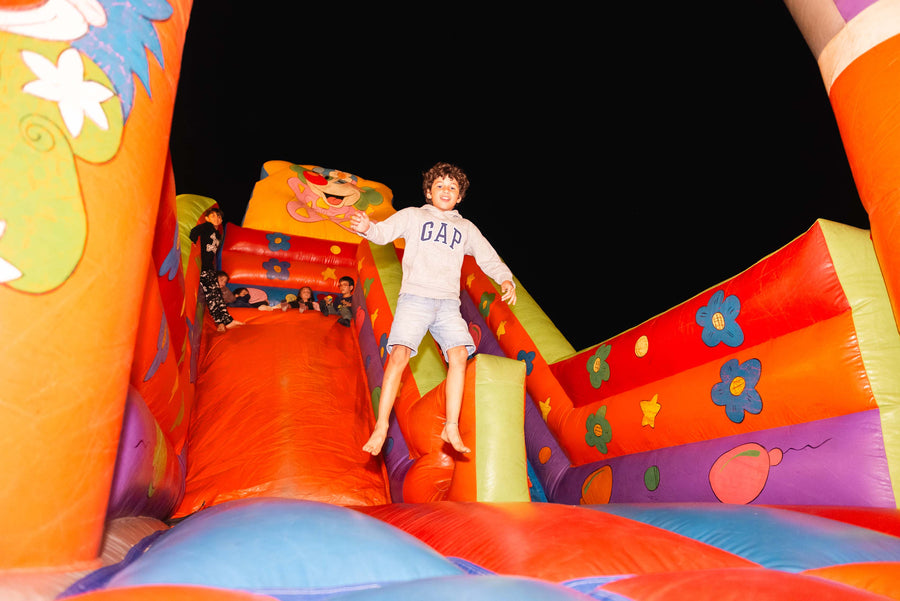 Children playing on a bouncy castle